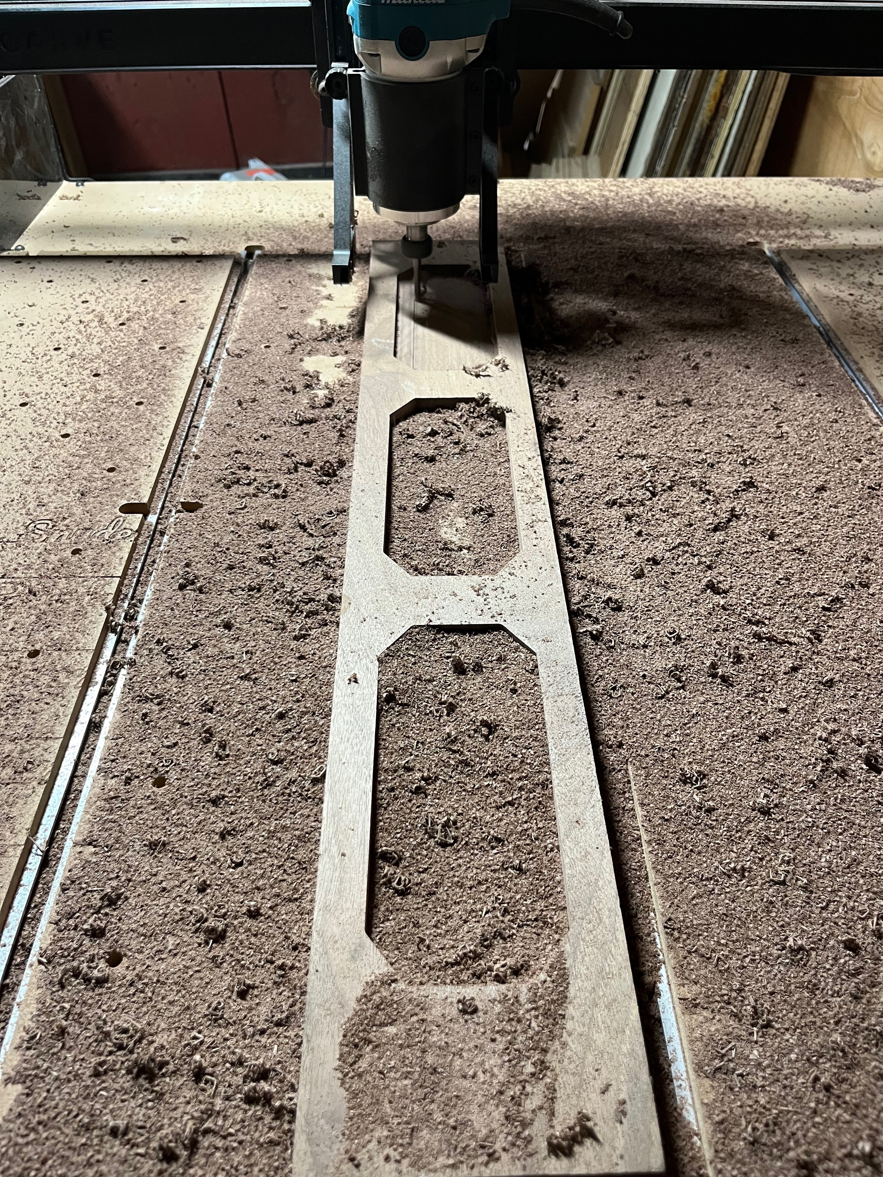 CNC router cutting out walnut catchall organizer trays in the Lonoke Designs workshop.