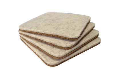 Stack of 4 Lonoke Designs Wool White wool felt and cork coasters.