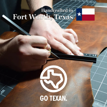 A close-up of a person's hands using a marking knife to cut a piece of brown leather, with text reading 'Handcrafted in Fort Worth, Texas' and a Texas flag. A large GO TEXAN logo.