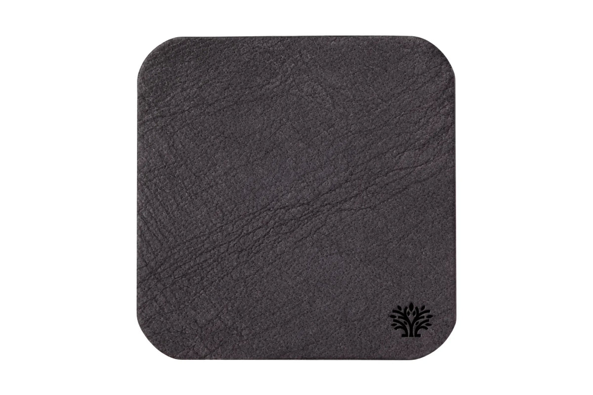 An Espresso dark brown veg-tanned leather square coaster with rounded corners, featuring a small Lonoke Designs logo in the bottom right corner, set against a plain white background.