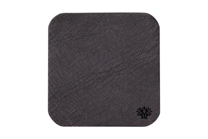 An Espresso dark brown veg-tanned leather square coaster with rounded corners, featuring a small Lonoke Designs logo in the bottom right corner, set against a plain white background.