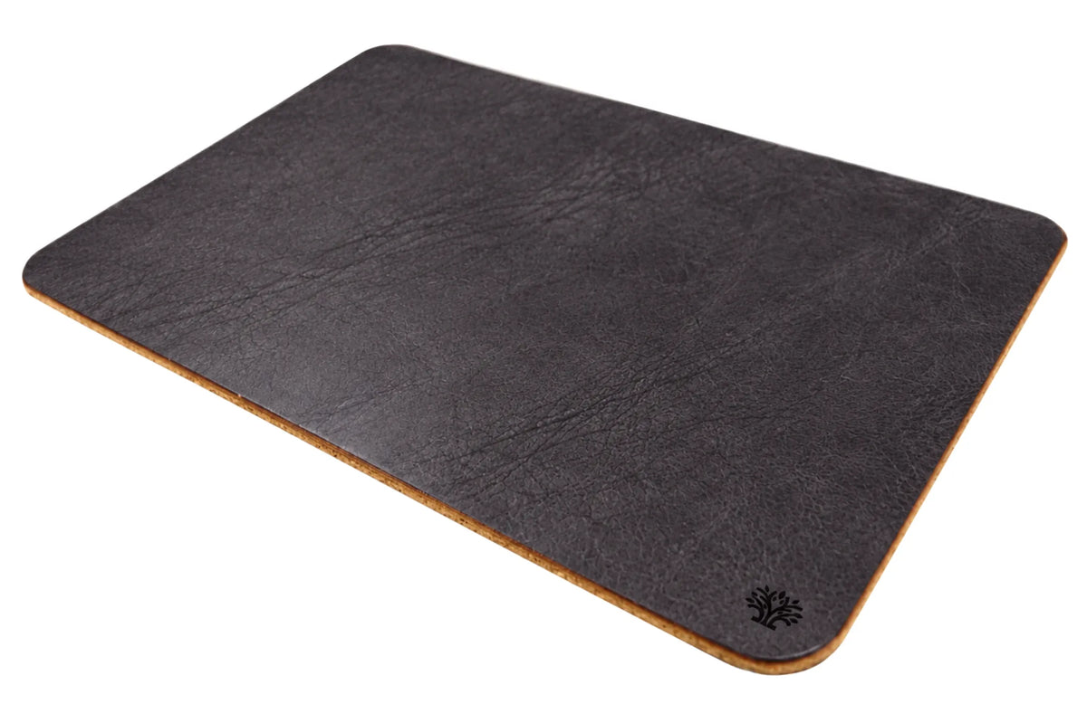 An Espresso dark-brown, veg-tanned leather rectangular mouse pad with rounded corners, angled to highlight the cork bottom, featuring a small Lonoke Designs logo in the bottom-right corner, set against a plain white background.