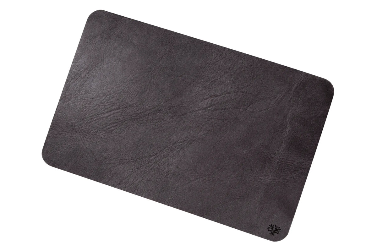 An Espresso dark brown, veg-tanned leather rectangular mouse pad with rounded corners, featuring a small Lonoke Designs logo in the bottom right corner, set against a plain white background.