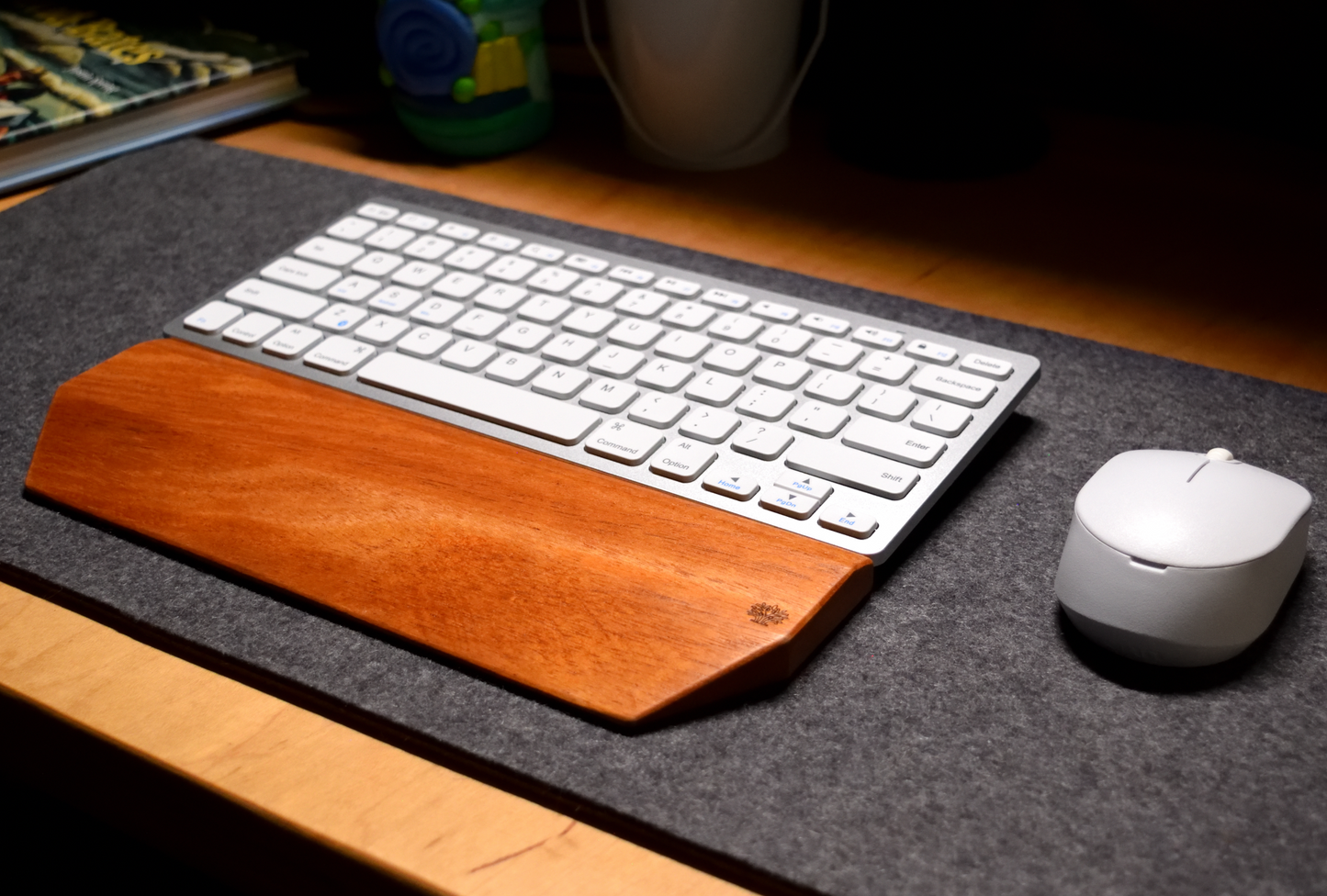 Keyboard with wrist rest and mouse on a desk