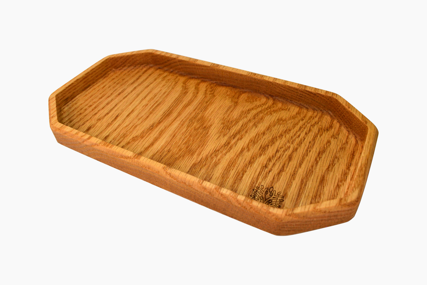 A rectangular oak wood organizer tray with visible wood grain, having a gentle lip on the edges.
