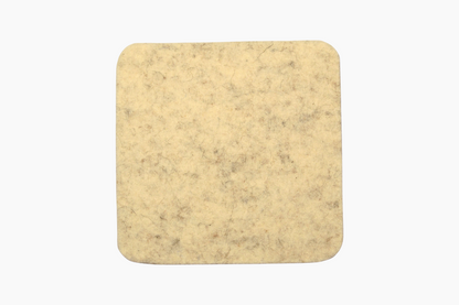 Square white wool coasters with a cork backing.