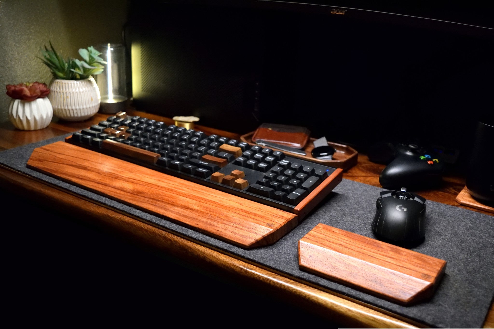 Full Lonoke Designs with a Red Zebrawood mechanical keyboard wrist rest and matching mouse rest on a wool felt desk pad.