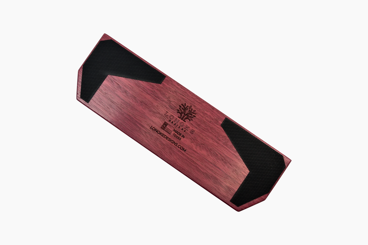 Back view of a Lonoke Designs Purpleheart hardwood wrist rest with Lonoke Designs engraving and rubber grips, handcrafted in Texas.
